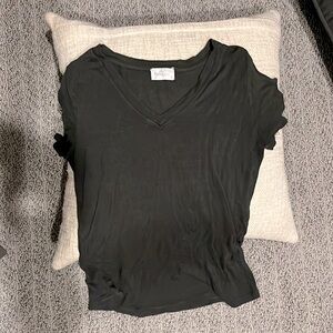 Stylish dark green shirt w cut out shoulders.